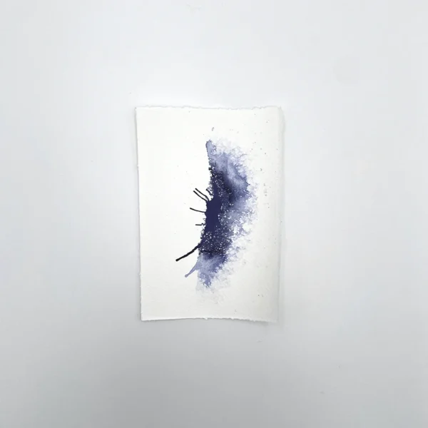 Prøve på indigo tegneblæk på akvarelpapir med gradient- og spredeeffekt.